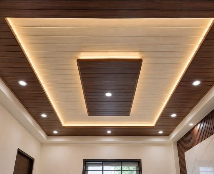 Stepped wood-tone ceiling with warm cove lighting